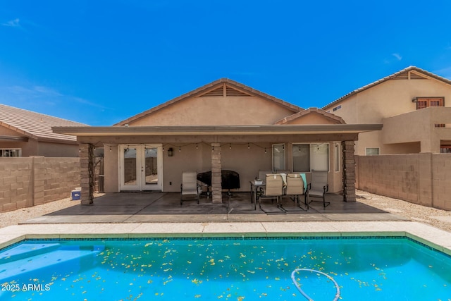 2516 E San Manuel Rd, San Tan Valley, AZ 85143 - view of pool featuring french doors, a fenced backyard, and a patio
