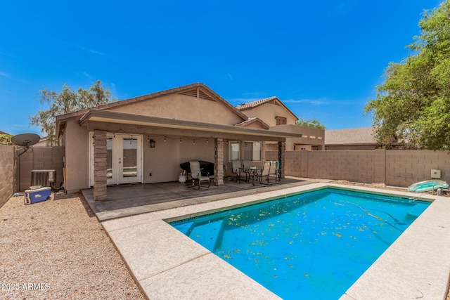 2516 E San Manuel Rd, San Tan Valley, AZ 85143 - view of pool with a fenced backyard, french doors, and a patio