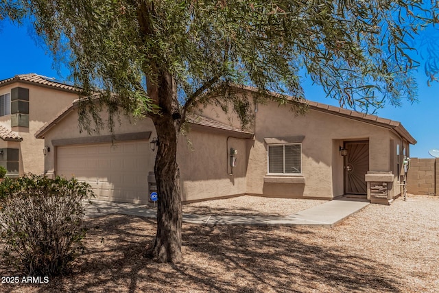 2516 E San Manuel Rd, San Tan Valley, AZ 85143 - view of front of property featuring stucco siding, a garage, a tiled roof, and concrete driveway