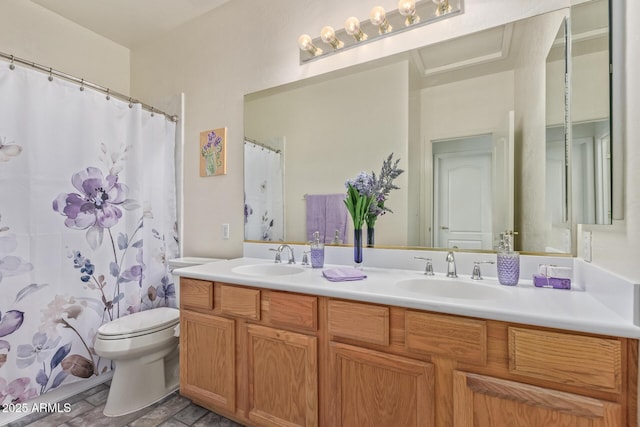 bathroom featuring a sink, toilet, double vanity, and a shower with curtain