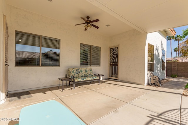 view of patio / terrace featuring visible vents, fence, and ceiling fan