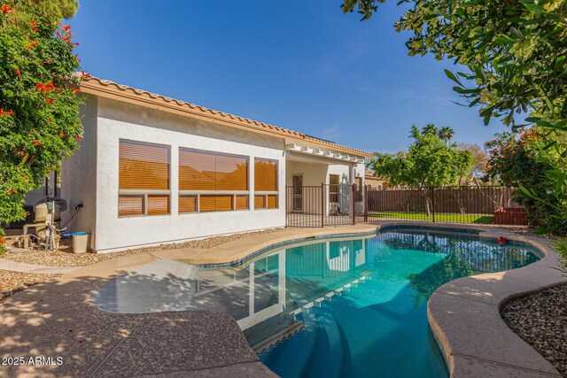 view of pool featuring a fenced in pool, a patio, and fence