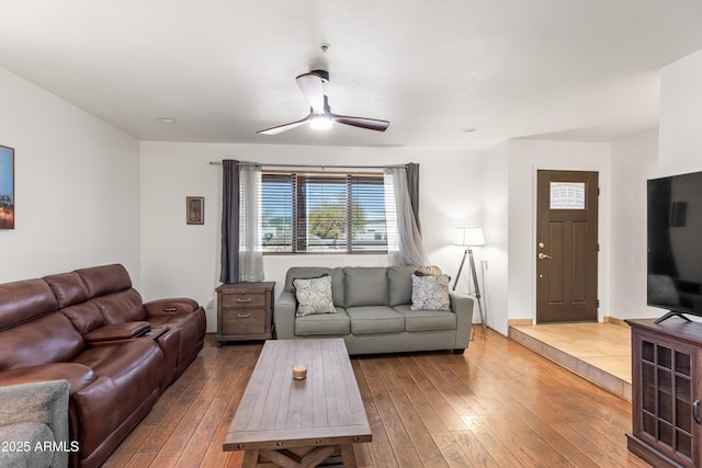 living room featuring hardwood / wood-style flooring and ceiling fan