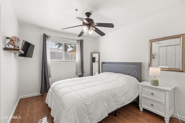 bedroom featuring dark wood-type flooring and ceiling fan