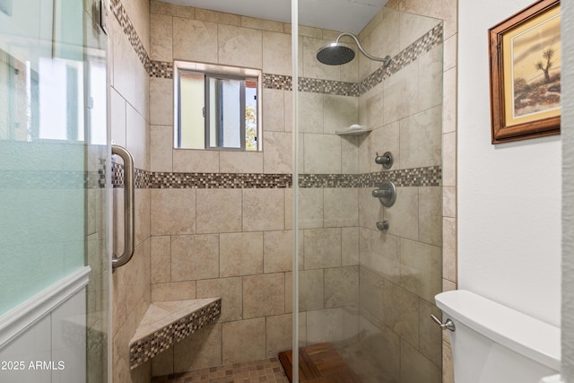 bathroom with toilet and walk in shower