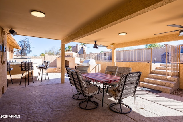 view of patio featuring ceiling fan