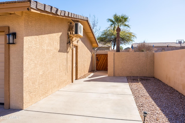 view of property exterior featuring a patio area