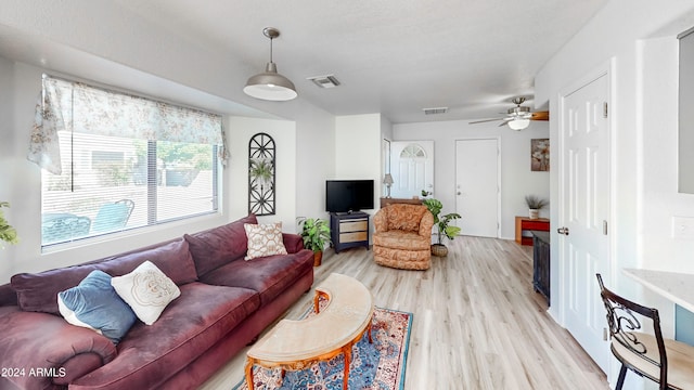 living room with ceiling fan and light hardwood / wood-style floors