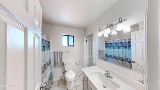 bathroom with toilet, vanity, a textured ceiling, and tile patterned floors