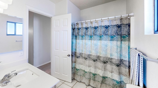 bathroom with vanity and tile patterned flooring