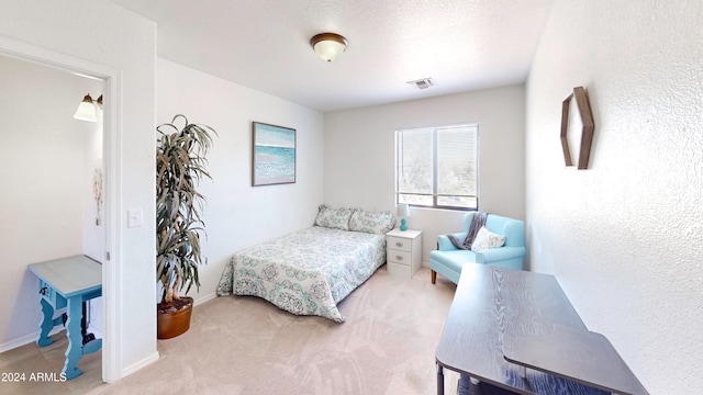 bedroom featuring light colored carpet