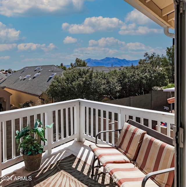 wooden deck with a mountain view