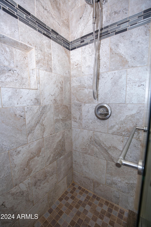 bathroom with tiled shower