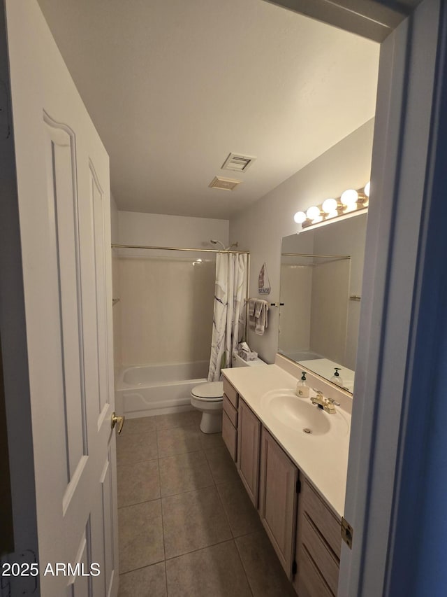bathroom featuring tile patterned floors, toilet, shower / bathtub combination with curtain, and vanity