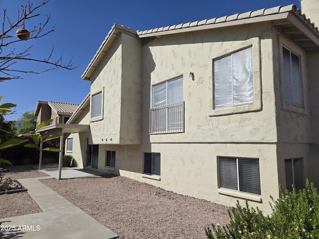 view of property exterior featuring a patio area and stucco siding