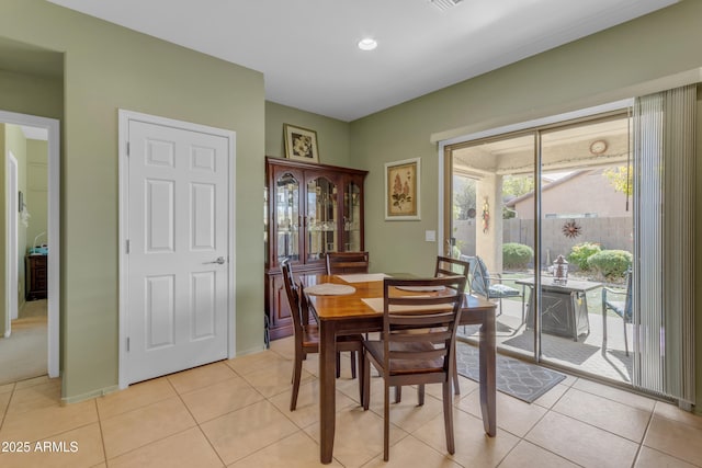 dining space with light tile patterned floors