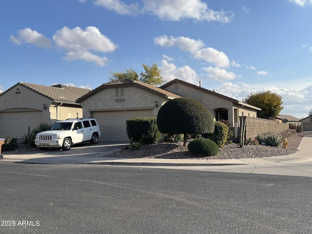 ranch-style home featuring a garage