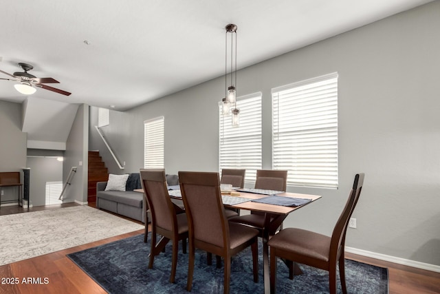 dining area featuring hardwood / wood-style flooring and ceiling fan