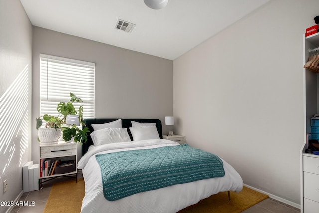 bedroom featuring light tile patterned floors