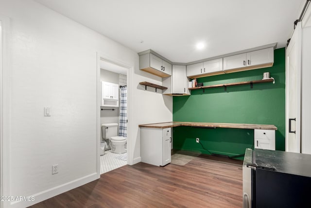 kitchen with dark hardwood / wood-style flooring