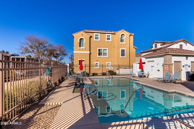 view of swimming pool featuring a patio area