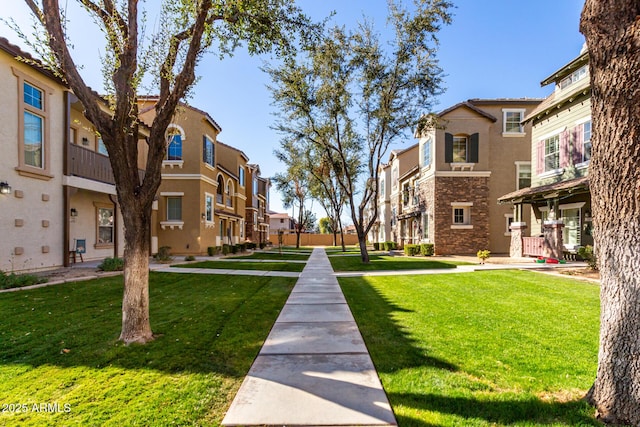 view of home's community with a lawn