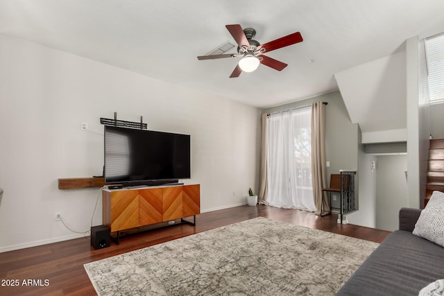 living room featuring dark hardwood / wood-style floors and ceiling fan