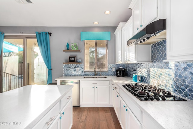 kitchen featuring hardwood / wood-style floors, white cabinets, dishwasher, sink, and black gas cooktop