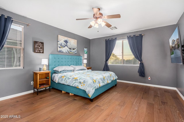 bedroom featuring ceiling fan and hardwood / wood-style flooring