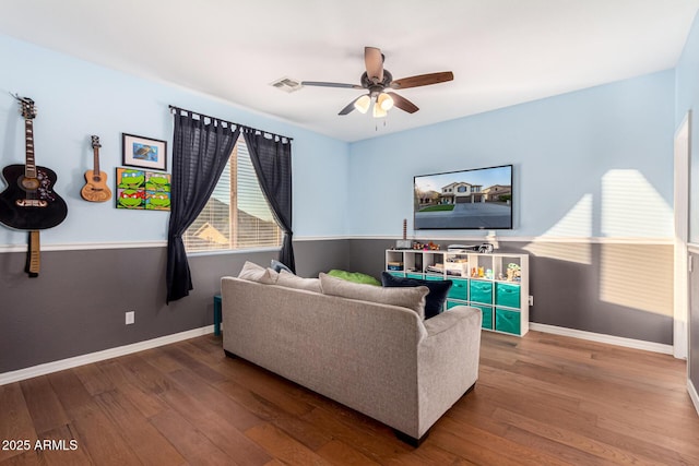 living room with ceiling fan and hardwood / wood-style floors