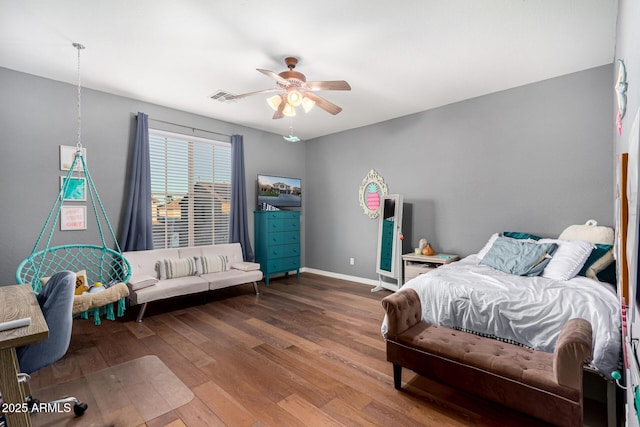 bedroom with ceiling fan and hardwood / wood-style flooring