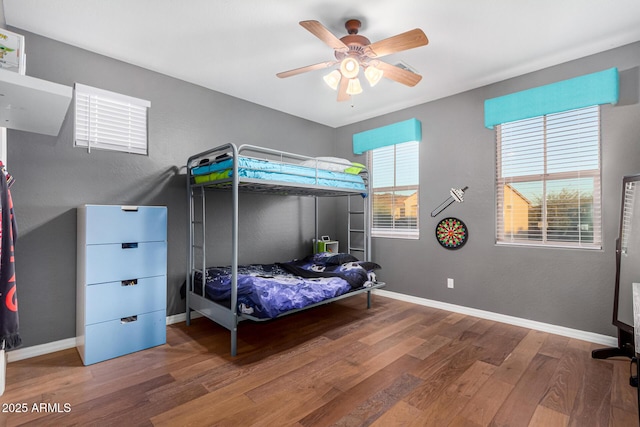 bedroom featuring ceiling fan and wood-type flooring