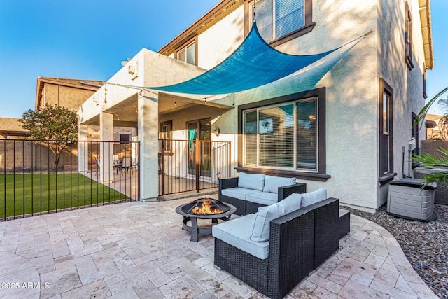 view of patio / terrace with an outdoor living space with a fire pit