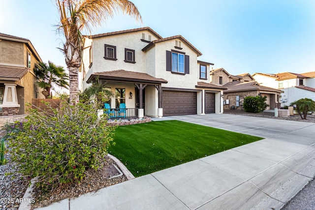 mediterranean / spanish-style house featuring a front yard, covered porch, and a garage