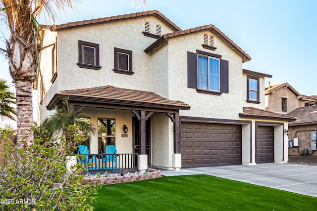 mediterranean / spanish-style house with a front yard, a garage, and a porch