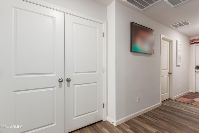 corridor with dark hardwood / wood-style floors