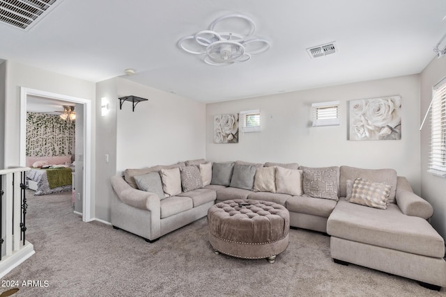 living room featuring carpet floors and visible vents