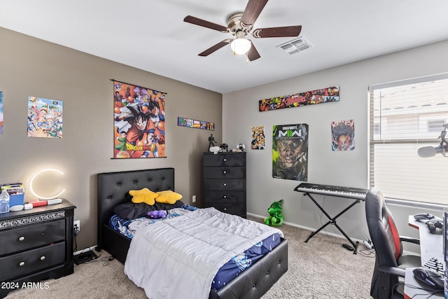 carpeted bedroom with visible vents, baseboards, and ceiling fan