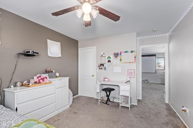 bedroom featuring ceiling fan, light carpet, and baseboards