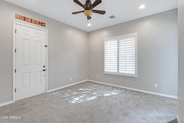 unfurnished room featuring carpet flooring and ceiling fan