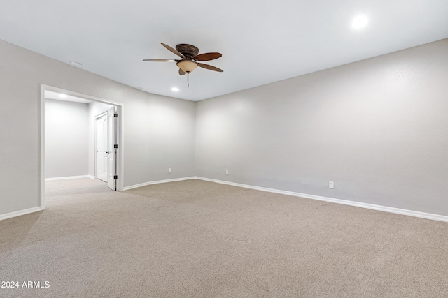 carpeted empty room with ceiling fan