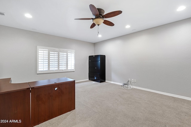 unfurnished office with light colored carpet and ceiling fan