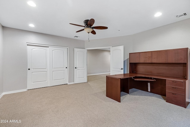 unfurnished office with light colored carpet and ceiling fan