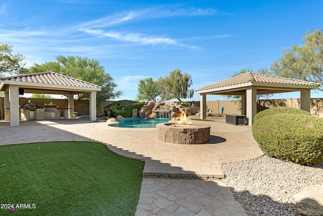 view of yard with an outdoor fire pit, a patio, and a gazebo