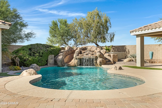 view of swimming pool featuring a patio area and pool water feature