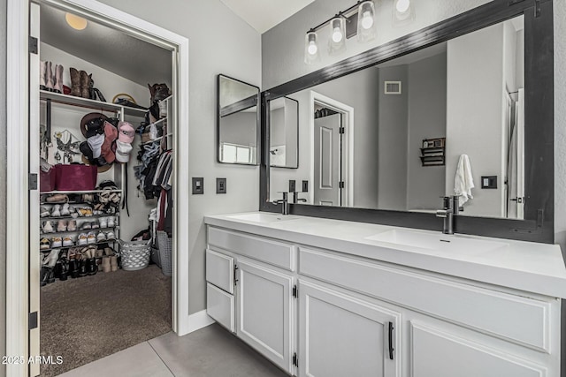 3856 E Encinas Ave, Gilbert, AZ 85234 - bathroom with double vanity, tile patterned flooring, and a spacious closet