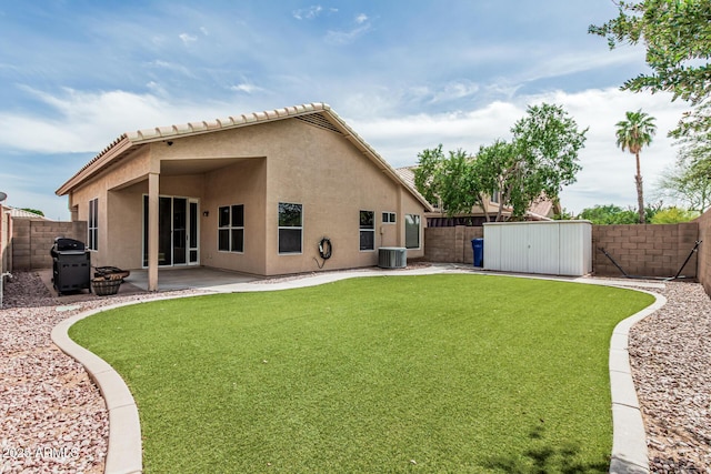3856 E Encinas Ave, Gilbert, AZ 85234 - back of property with stucco siding, a patio, an outbuilding, a storage shed, and a tiled roof