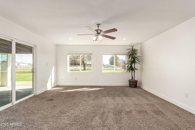 empty room with carpet flooring and ceiling fan