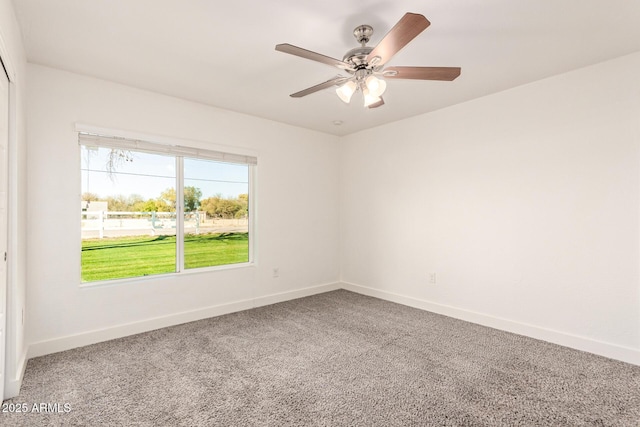 carpeted empty room with ceiling fan