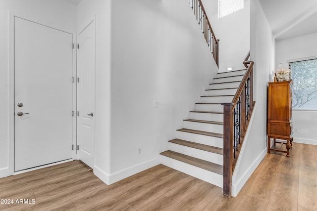 stairs with hardwood / wood-style flooring